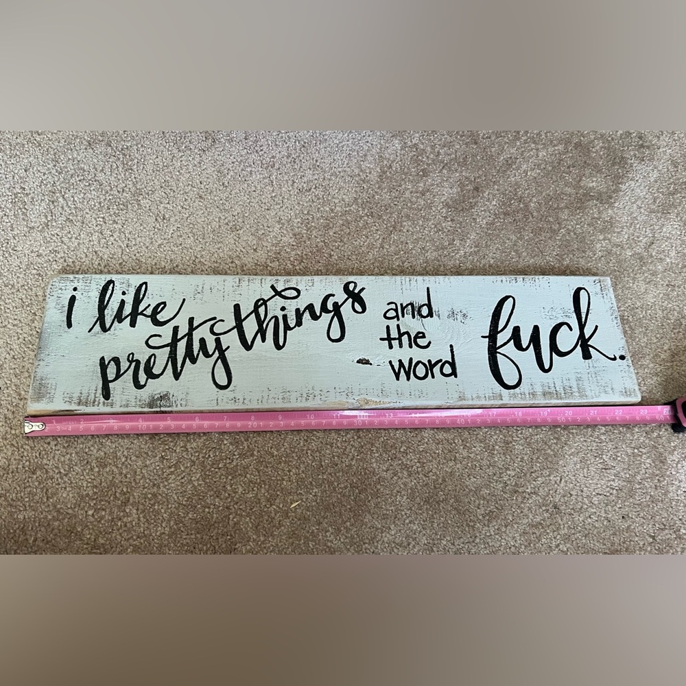 Decorative Wooden Sign with Black Text